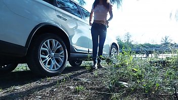 Tina, a hot Asian babe in tight blue jeans, offers quick roadside relief—piss breaks and deep throat service for desperate drivers. No time wasted, just raw satisfaction on the go.